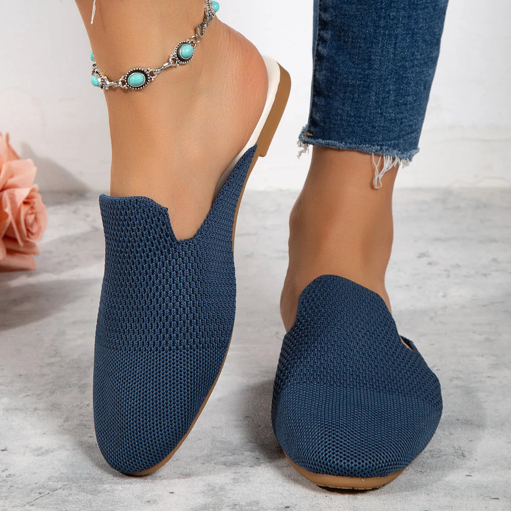 Apricot coloured mesh slip-on sandals with a round toe and flat rubber sole.