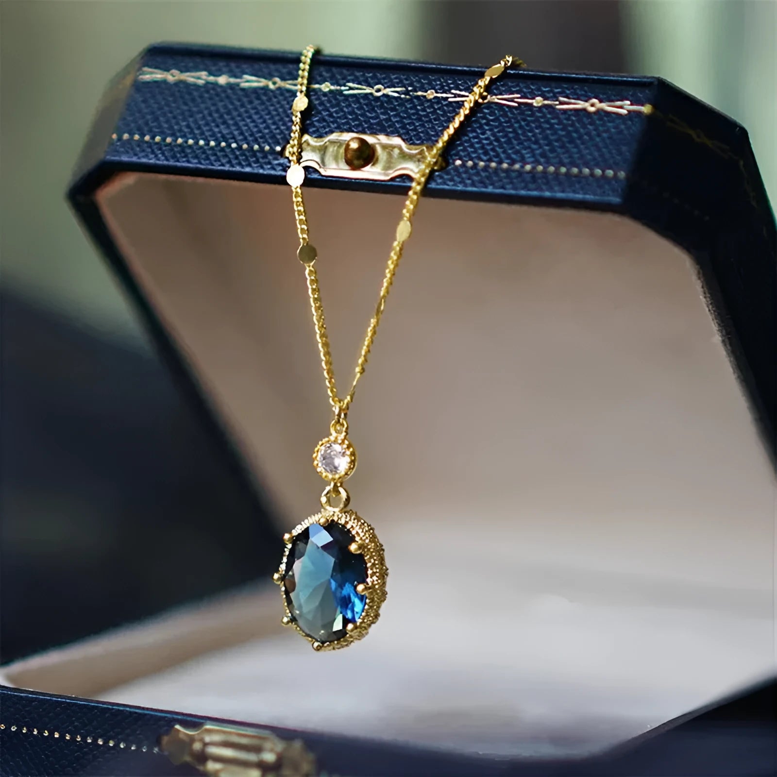Gold geometric pendant necklace with French retro styling on copper chain