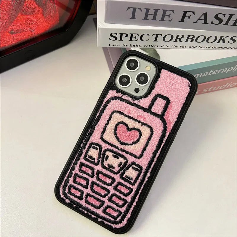 Pink towel embroidered TPU iPhone case showing textured surface on back cover.