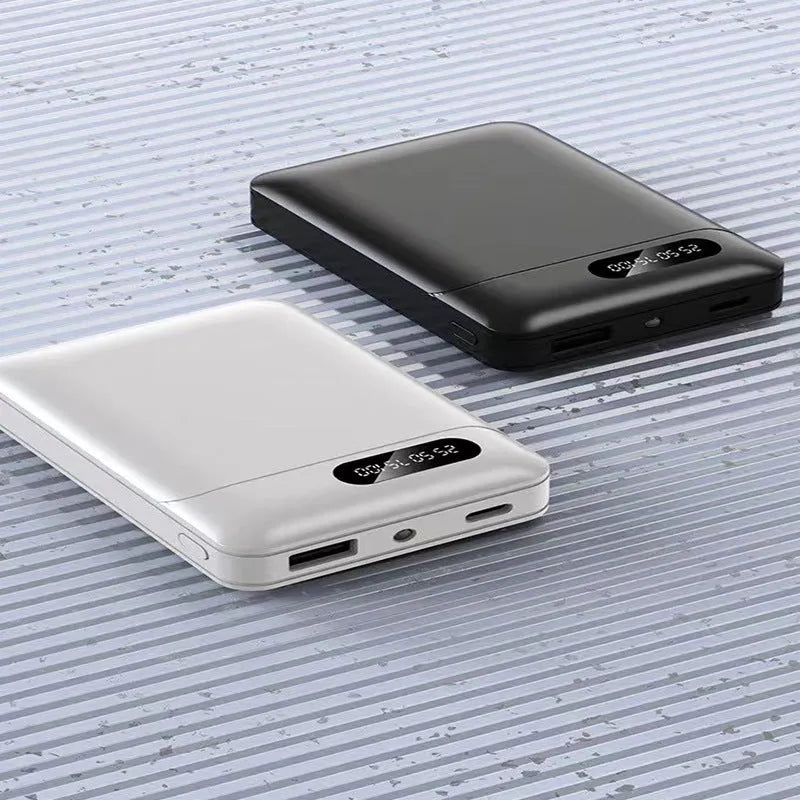 White and black portable power bank with multiple capacity options and USB charging ports