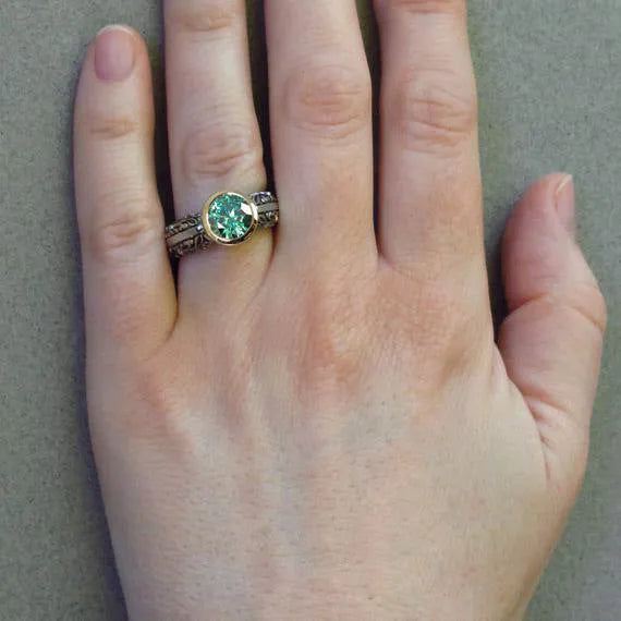 Gold-plated flower-shaped vintage ring with green silver finish and gemstone accents