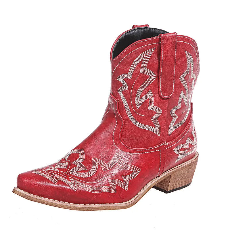Blue women's cowboy boots with embroidery on the shaft and a low wedge heel.