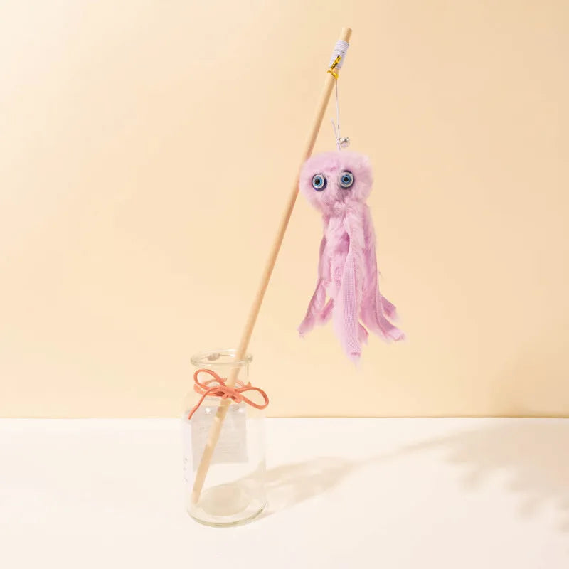 Grey furry octopus cat toy with eyes on a long stick for interactive indoor play with kittens.