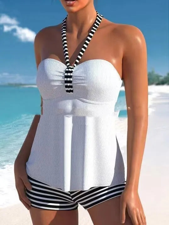 Women's off-shoulder one-piece swimsuit in solid white and black/white striped patterns.