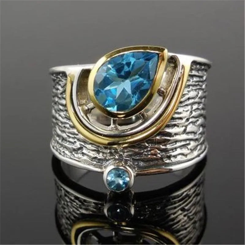 Blue zircon Chinese style women's ring with drop shape design and alloy construction
