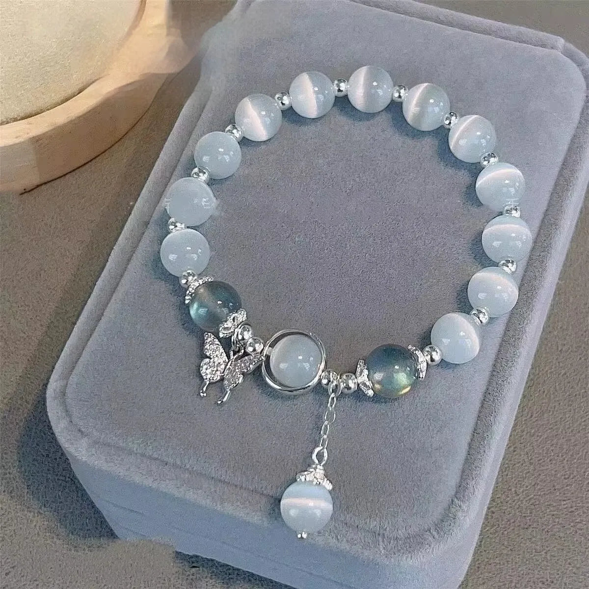 Women's glass butterfly bracelet with coloured glaze beads in drop shape design