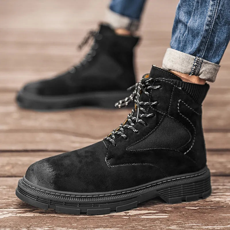 Men's vintage Martin boots in black with a round toe and low thick heel on a rubber sole.