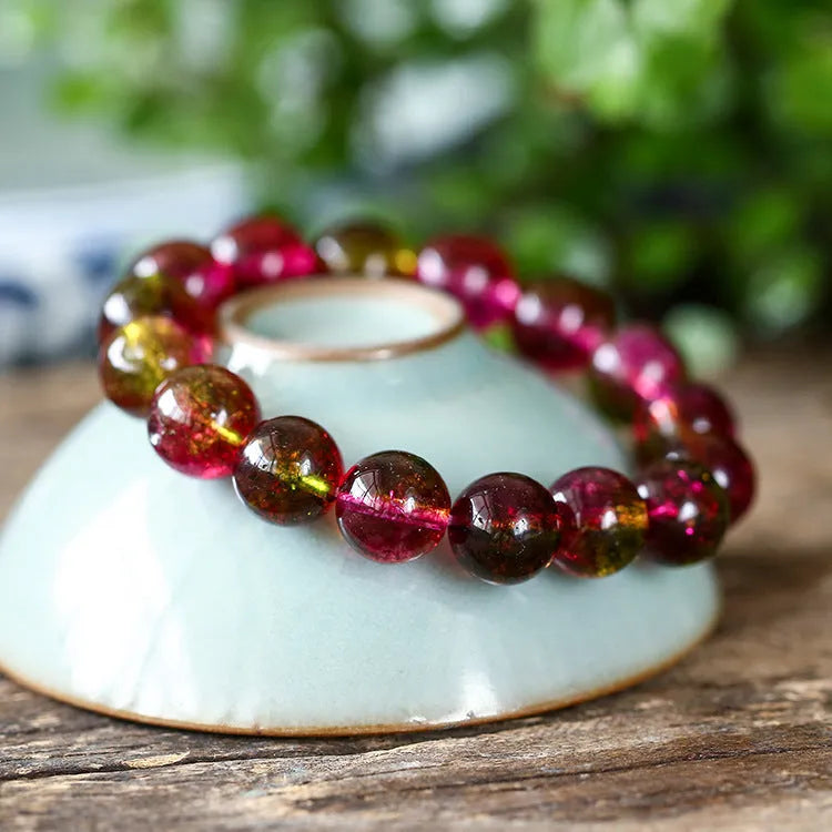 Handmade watermelon crystal bracelet in pastoral style shown in available sizes.