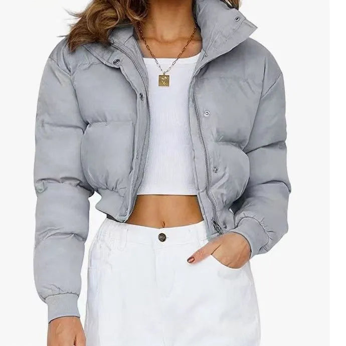 Women's loose blue polyester casual jacket with long sleeves on a hanger.