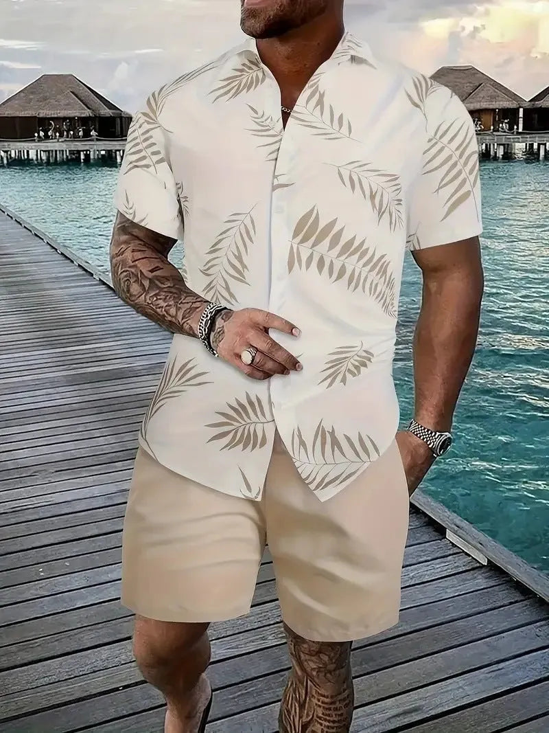 Man wearing a blue Hawaiian print short sleeve shirt and matching shorts from the casual suit set.