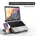 Black ABS plastic laptop bracket with adjustable tilt angle on wooden desk
