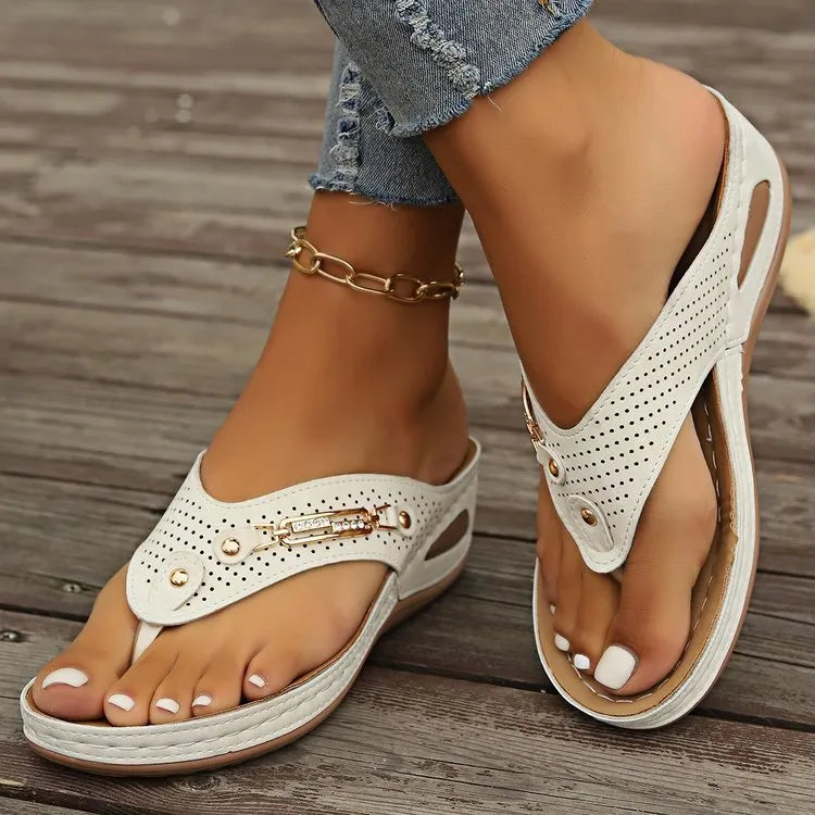 Women's retro flip-flop sandals in light brown colour showing PU upper material and herringbone scaffold design