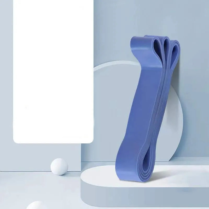 Set of five TPR stretch resistance bands in light blue, grey, pink, fruit green, and dark blue on a white background