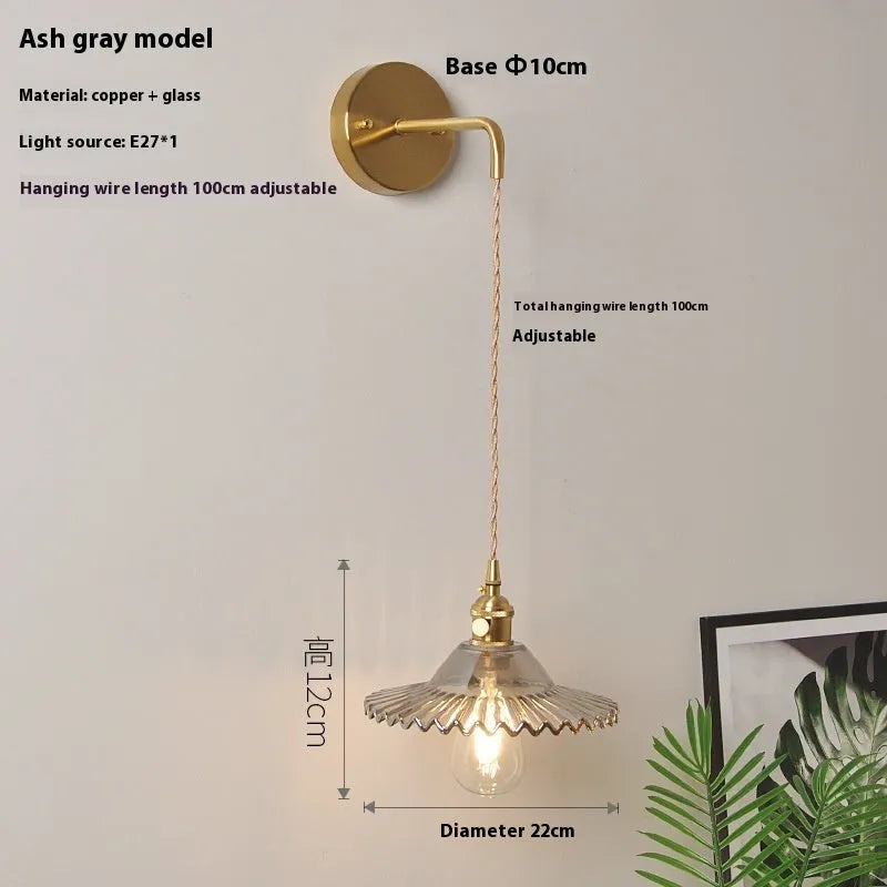 Retro copper lotus wall lamp with glass shade in choice of six colours, suspended from a wall
