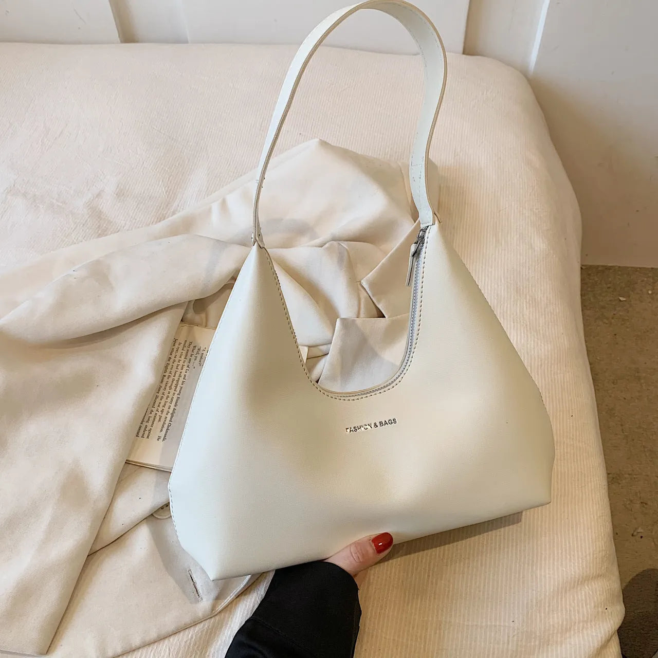 Retro style cream yellow PU shoulder handbag with single strap, sandwich pocket, and stitching detail.