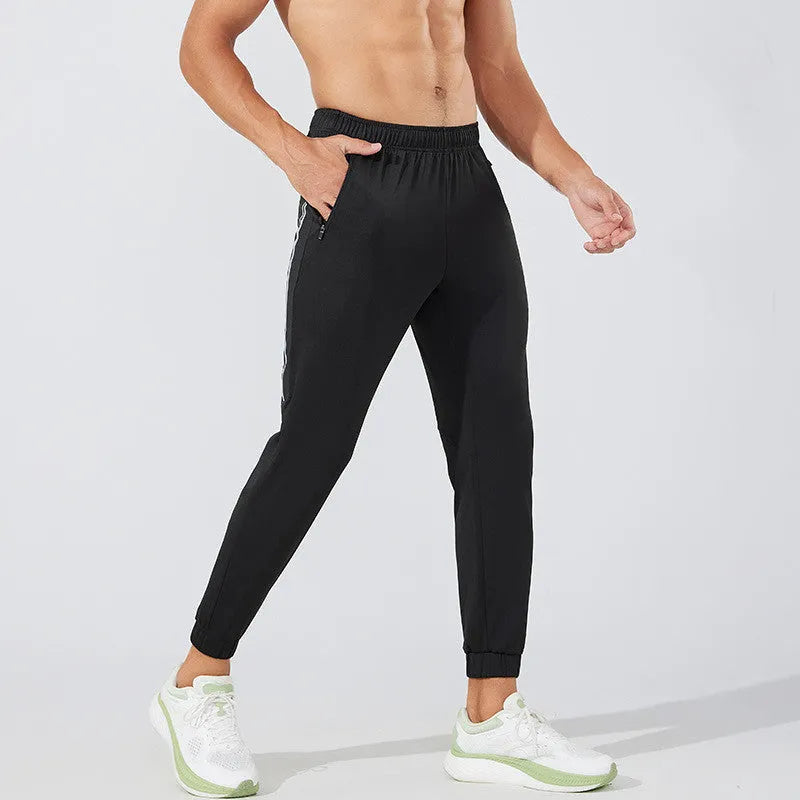 Men's black polyester running trousers with mid-waist design for exercise and gym workouts