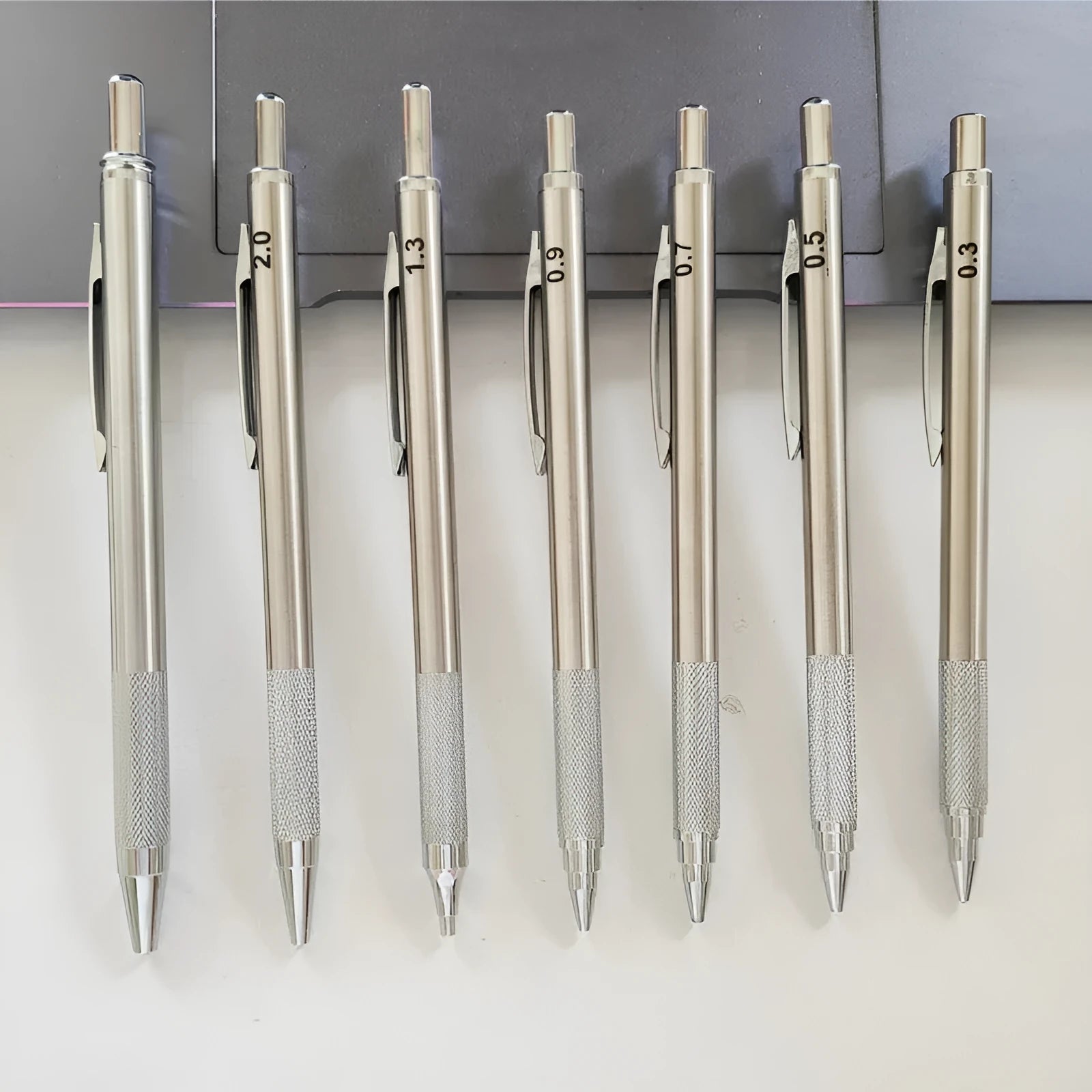 Metal automatic mechanical pencil compatible with five sizes of 2B lead refills.