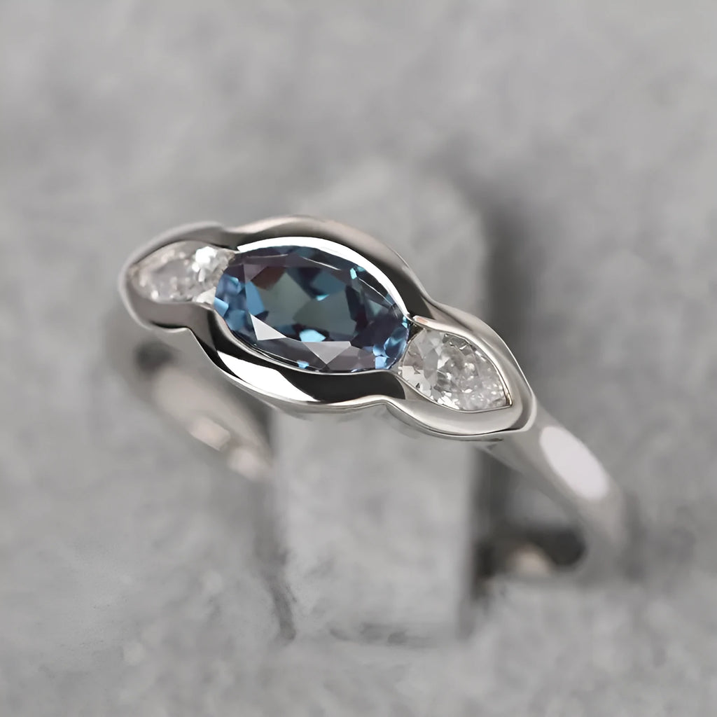 Women's geometric ellipse ring with inlaid zircon stones in white gold tone finish on finger