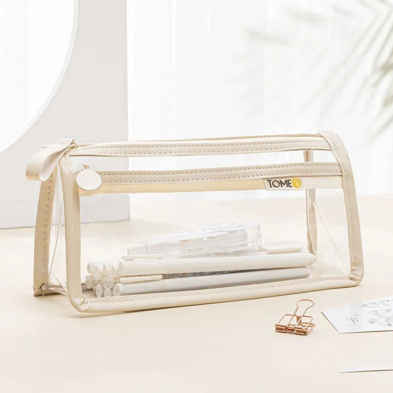 Large transparent double-layer pencil case in blue showing internal compartments, dimensions 220x110x80mm.