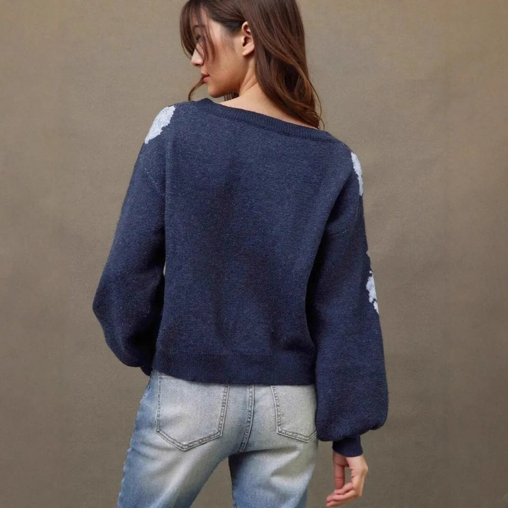 Sapphire blue women's loose pullover with a raised floral jacquard pattern and long sleeves.