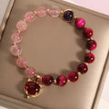 Women's strawberry crystal bracelet on elastic rope measuring 18cm with simple jewellery design