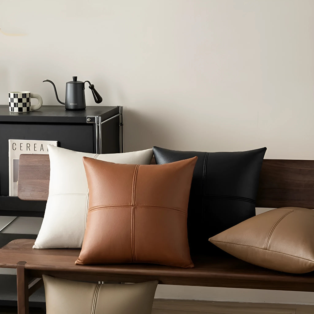 Soft cowhide leather pillow cover in a solid colour on a sofa.