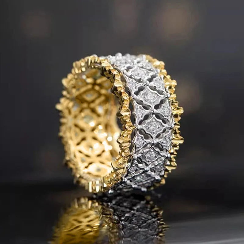 A geometric two-tone zircon ring with a gold-colour electroplated copper finish and round details.