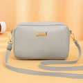 Solid colour women's PU shoulder bag with three-dimensional pocket design in urban simple style