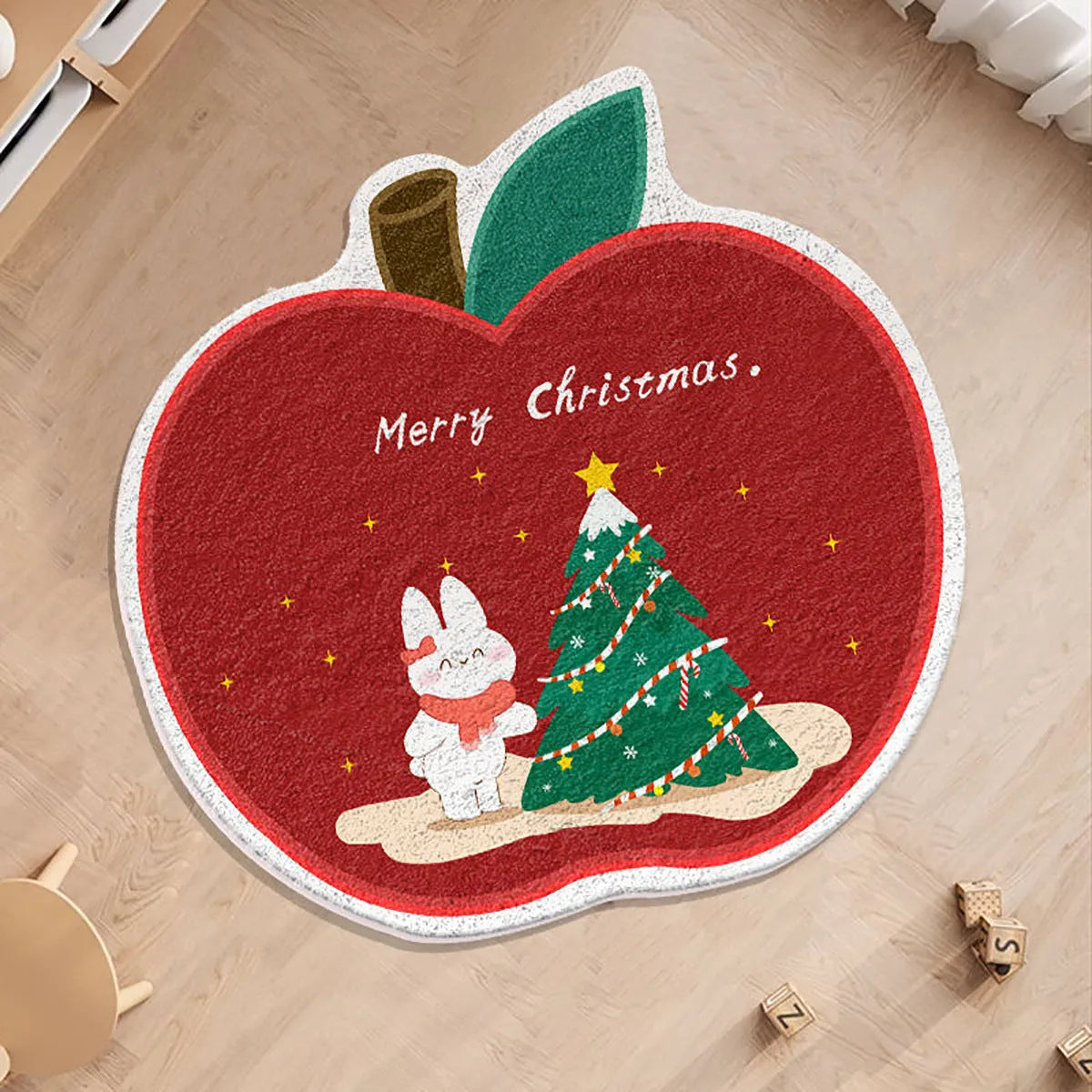 Round Christmas carpet with alien shape design in imitation cashmere material on wooden floor