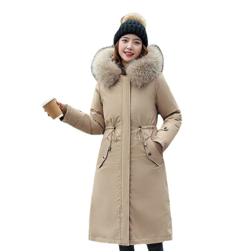 Long beige women's trench coat with cotton-padded fleece construction on a hanger.