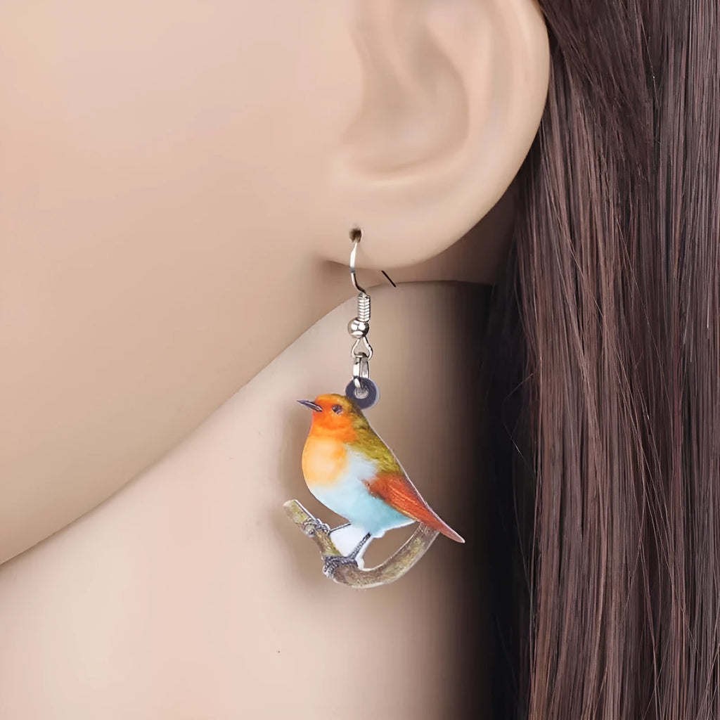 Acrylic blue titmouse pendant earrings with geometric animal and snake zodiac design in colourful printing
