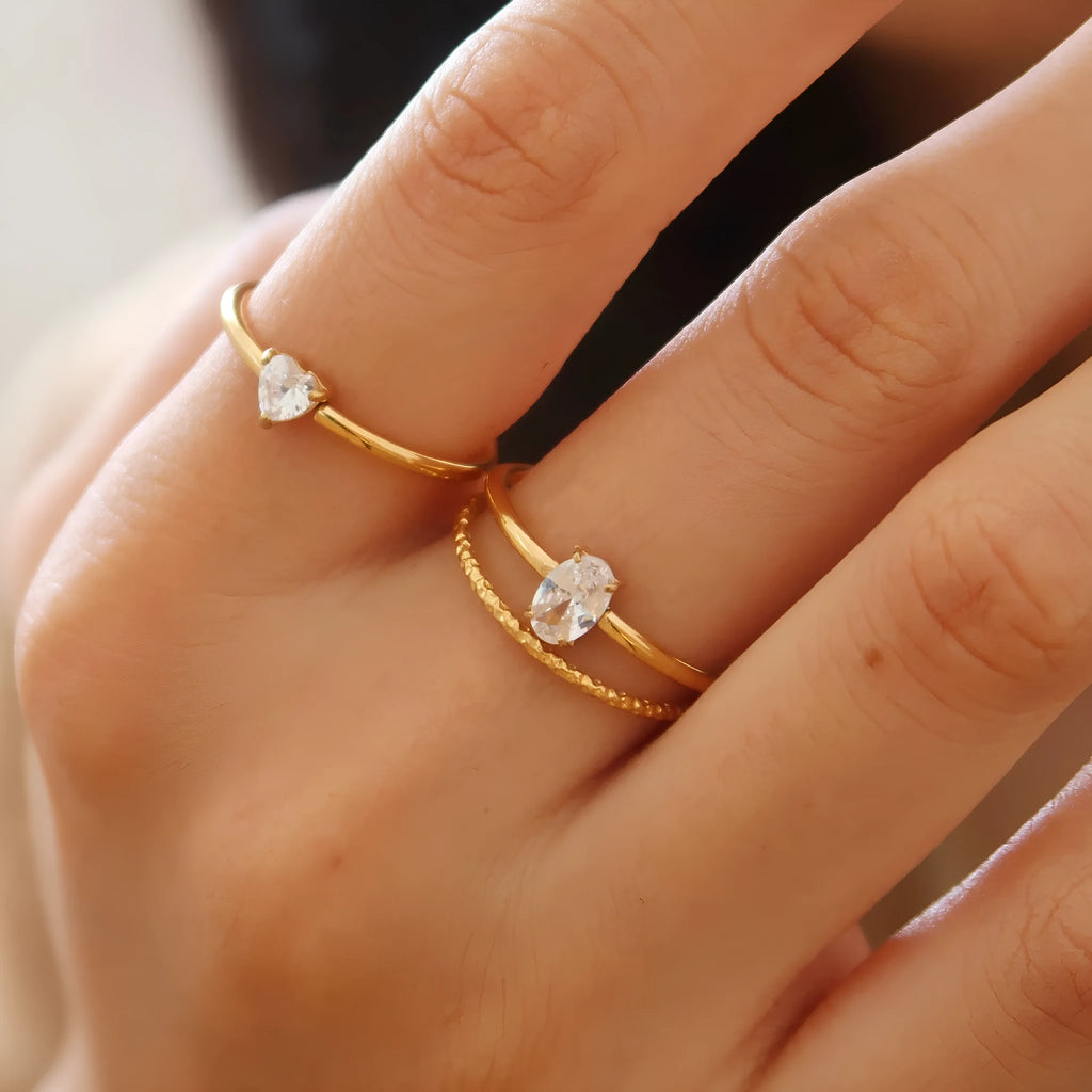 Golden electroplated stainless steel ring with love heart shape and oval bath design