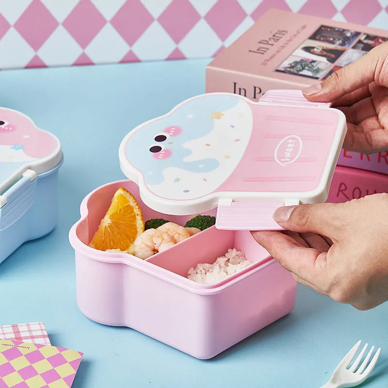 Creative blue and pink ice cream shaped plastic lunch box with spoon and fork on a table