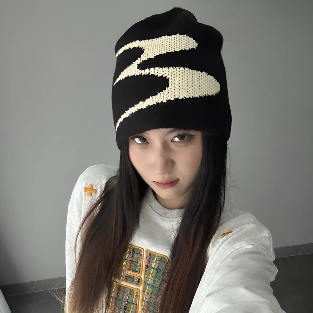 Medium-sized acrylic beanie hat for men and women in black colour showing knit texture