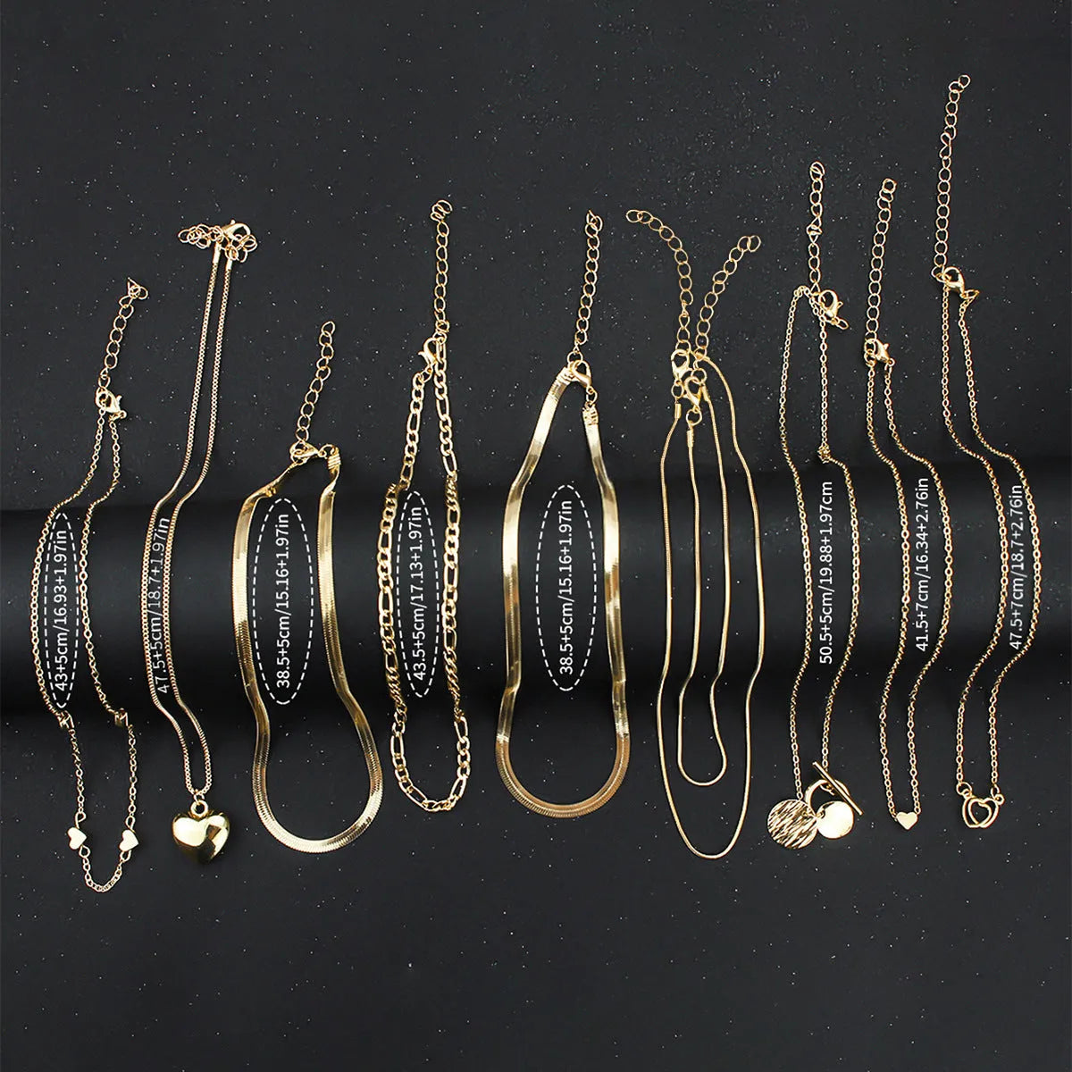 Gold necklace set with ten alloy pendants on adjustable snake bone chain