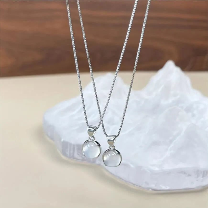 Korean-style oval pendant necklace with geometric eight-point star charm on an adjustable box chain.