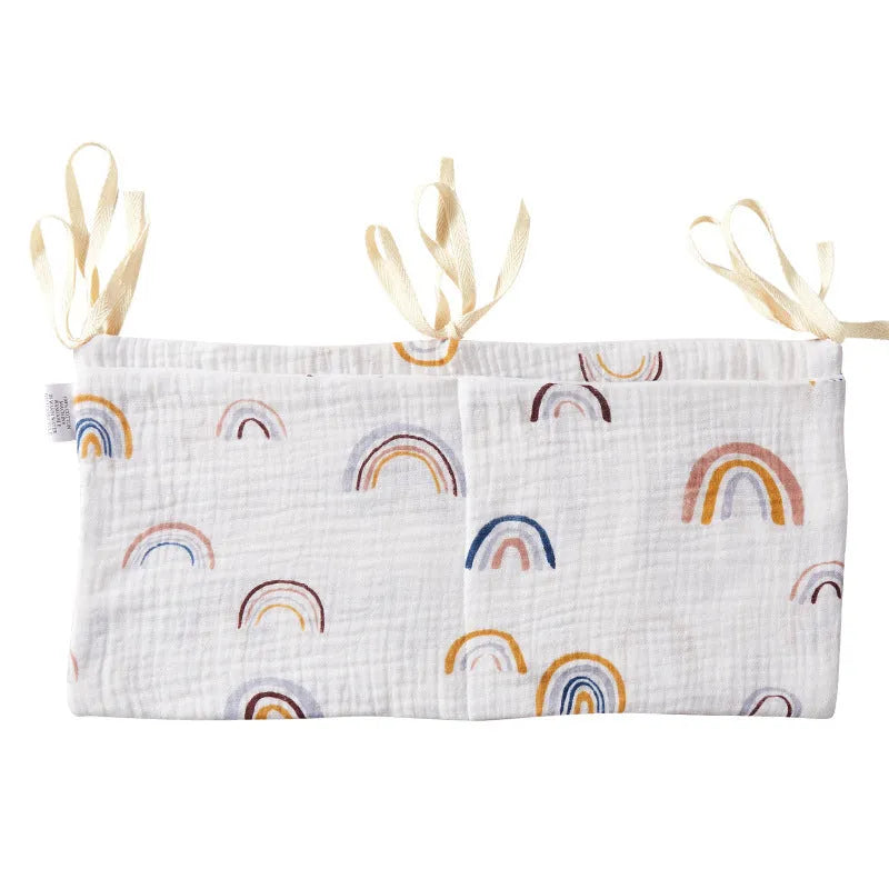 Cotton double layer baby bedside buggy bag in camel colour with tie straps attached to a pram handle