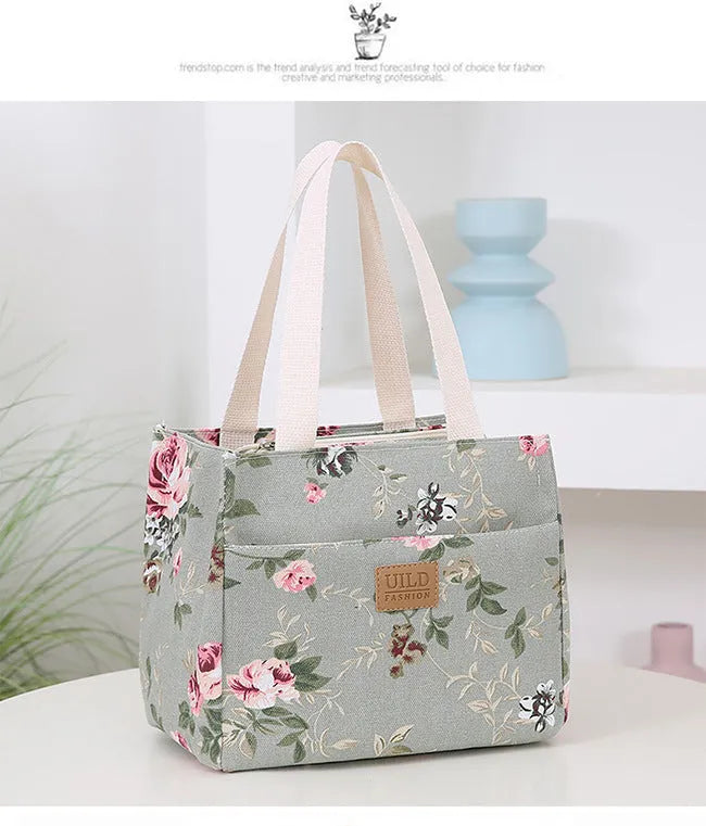 Women's printed canvas handbag with floral design and aluminium hardware in square shape