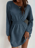 Blue women's knitted dress with hand-crocheted white flowers, a fitted waist, and a round neck.