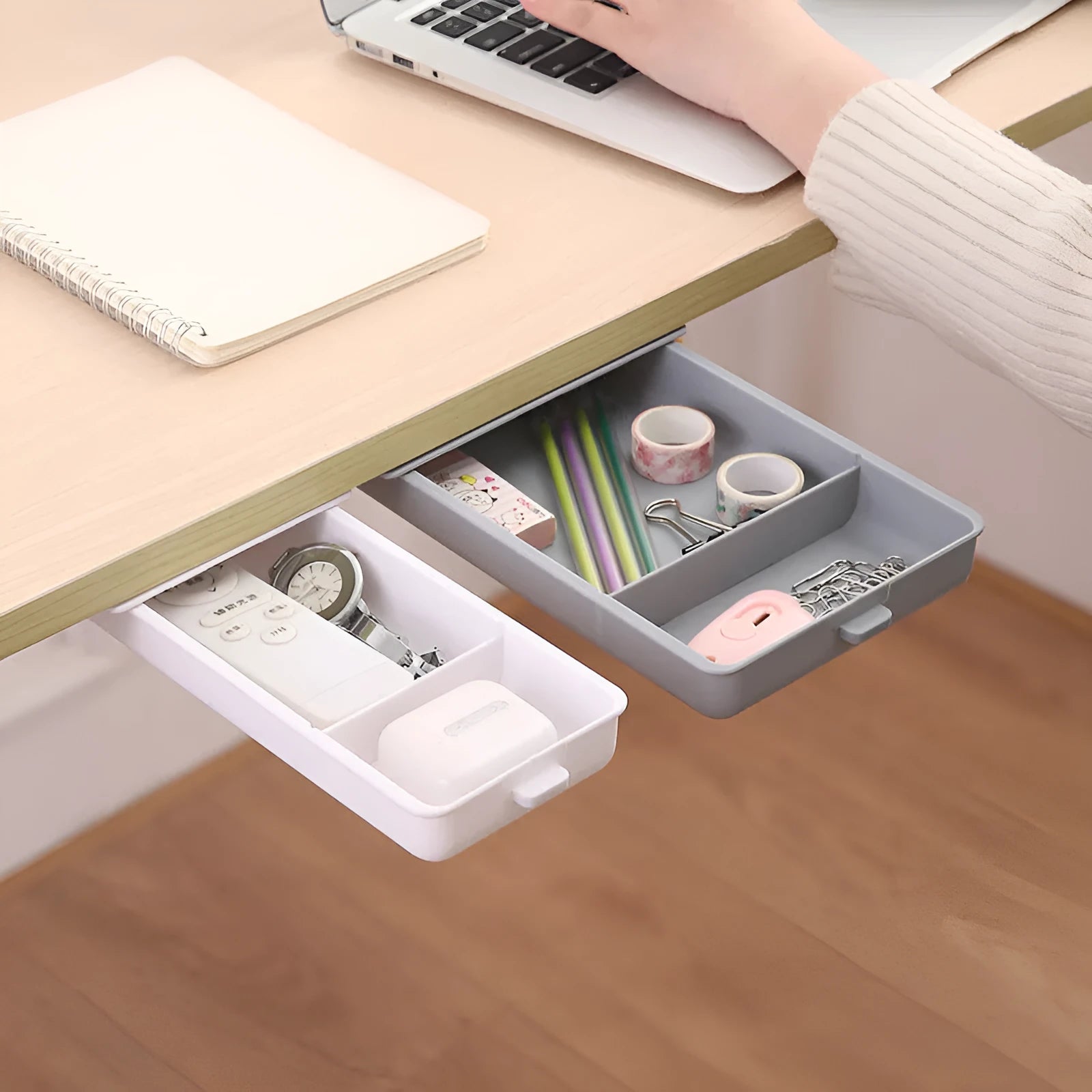 Small white plastic storage box with a grid pattern, shown adhered underneath a wooden table.