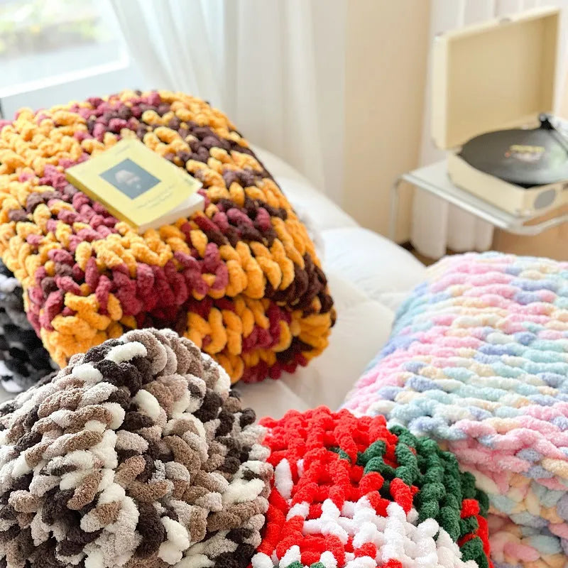 Thick striped chenille cover blanket folded to show texture and colour options including caramel mango and purple.