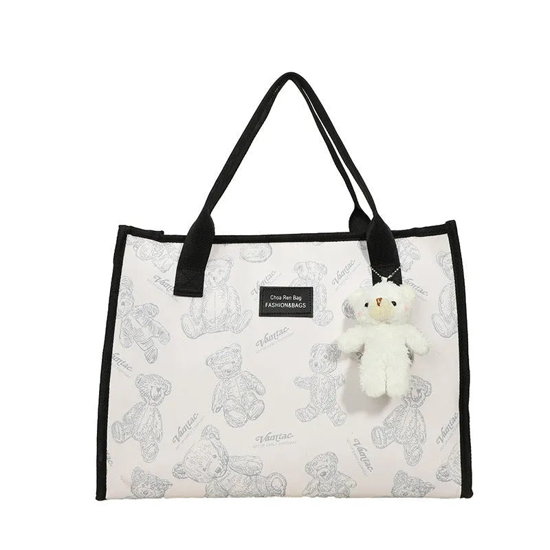 Women's black and white canvas tote bag with rhombus pattern and sandwich pocket design