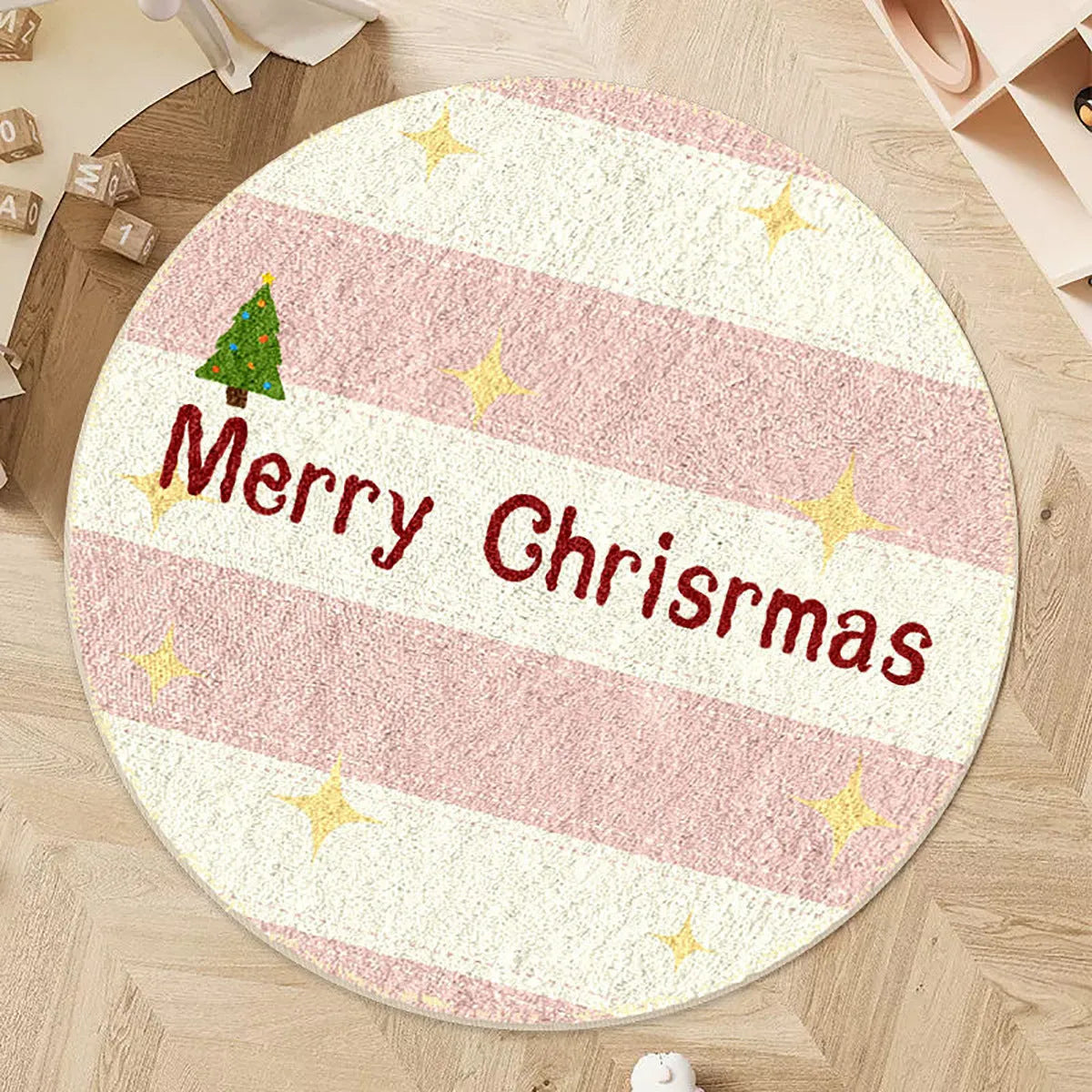 Round Christmas carpet with alien shape design in imitation cashmere material on wooden floor