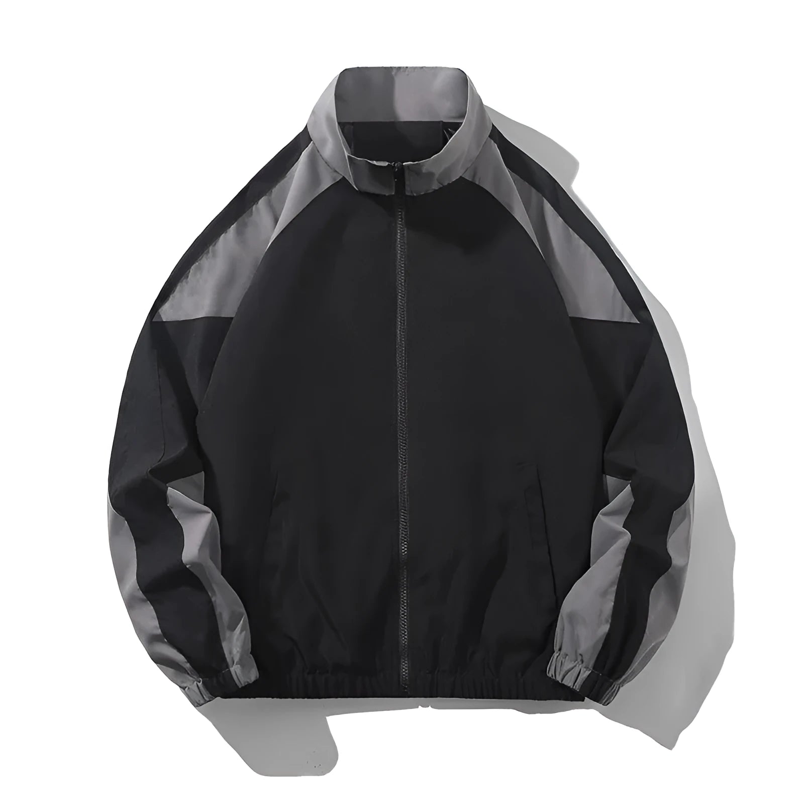 Man wearing a black casual jacket with contrast stitching and side pockets.