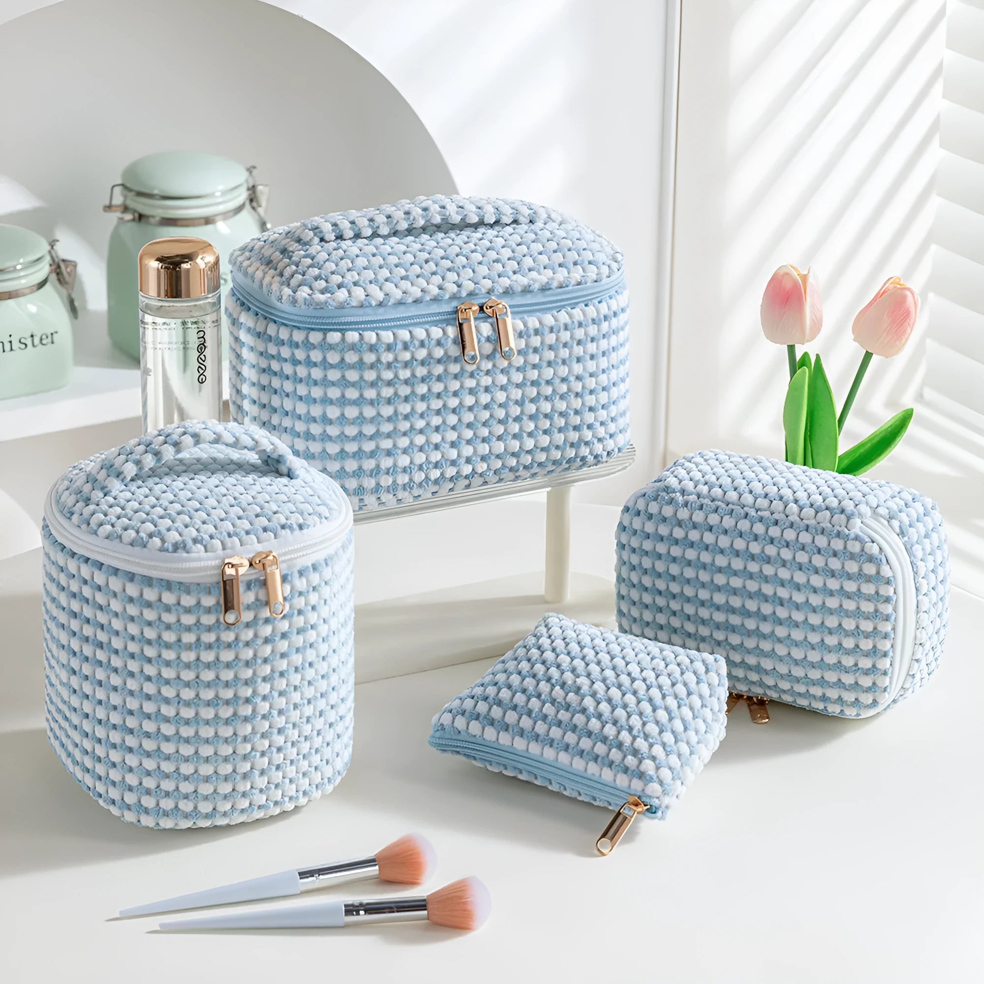 Four cube-style polyester makeup bags in pink, khaki, pink dots, and blue with dots colour options