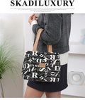 Women's printed canvas handbag with floral design and aluminium hardware in square shape