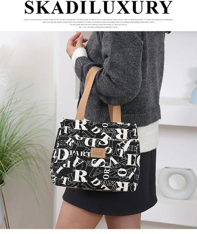 Women's printed canvas handbag with floral design and aluminium hardware in square shape