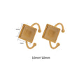 Assortment of golden stainless steel DIY jewellery settings in oval, heart, round, square, and rectangle shapes with totem pattern.