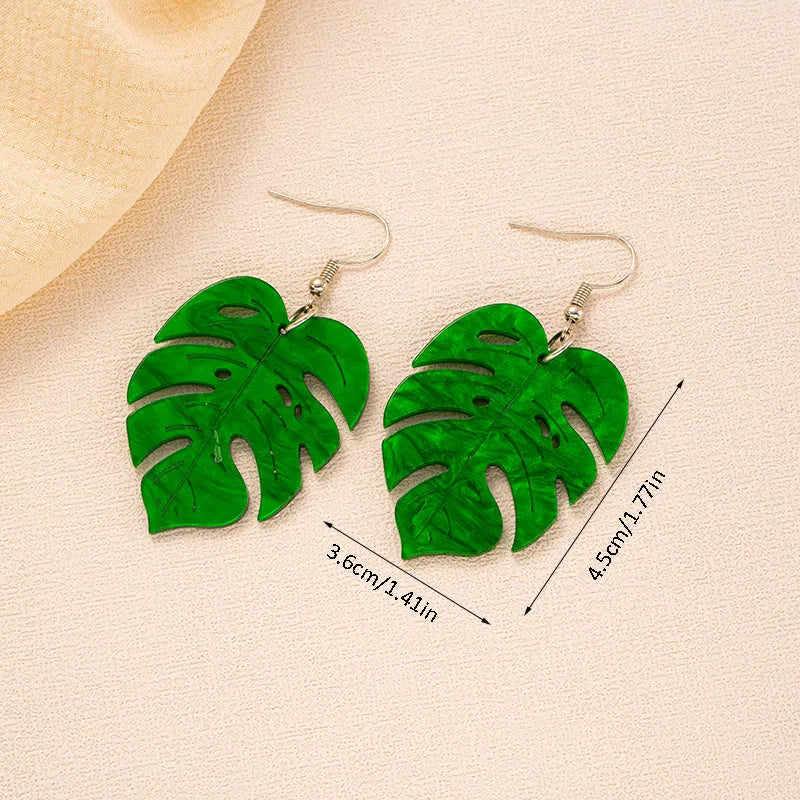 Drop shaped alloy and acrylic ear hook earrings with coconut summer design in multiple colours.