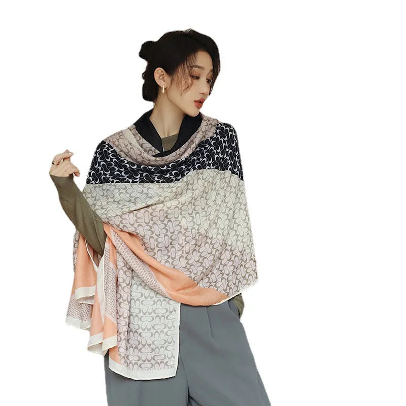 A woman wearing a printed polyester scarf, style 1, measuring 180cm by 90cm.